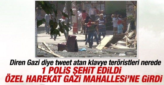Sultangazi Gazi Mahallesi'nde polis toplanıp yola barikat kurmaya çalışan bir